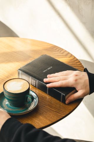 close-up-a-man-reads-the-bible-in-the-morning-2023-11-27-05-19-51-utc