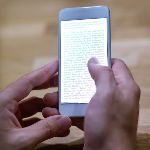 smart-stories-cropped-shot-of-a-person-reading-te-2023-11-27-05-27-07-utc